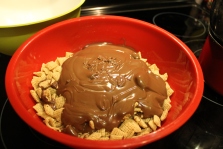 Pour the melted chocolate over the Chex cereal. (photo: Nikki Dulay)